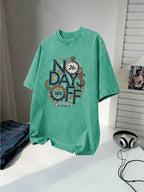 Men's Washed Short-sleeve T-shirt, Made of Pure Cotton for Breathability and Skin-friendly Comfort. Features a Relaxed Fit for Versatile Wear. Front Print with "NO DAYS OFF" Motivational Text and Gear Stopwatch Elements Exuding a Powerful Vibe - Green