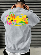 Official Warner Bros. Men's Fashion Trend Loose Fit Crew Neck Sweatshirt, Batman Joker HA Graffiti Ink Splatter Bat Logo Print Design, Versatile Long Sleeve Crew Neck Sweatshirt for Sports, Leisure, Commuting, Spring, Autumn, and Winter - Light Grey