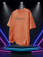 Men's Washed Short-Sleeve T-Shirt, Made of Pure Cotton Fabric That Is Breathable and Skin-friendly. The Relaxed Fit Is Comfortable and Versatile. Features a Creative Print of a Runner on the Front + EKG, Combining Athletic Passion with the Rhythm - Orange
