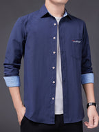 Men's Oxford Cloth Long-Sleeve Shirt for Spring/Autumn, with Lapel Collar, Simple Pocket, and English Print Decoration. Features Contrast Color Cuffs and Collar Design. A Versatile Basic Shirt for Business Casual Wear, Available in Multiple Colors - Dark Blue