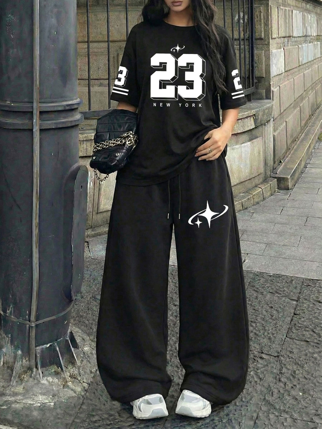 A Two-Piece Set for Women Featuring a Printed Round-Neck Short-Sleeve Top And Loose Drawstring Pants, Perfect for Trendy Summer Streetwear - Black