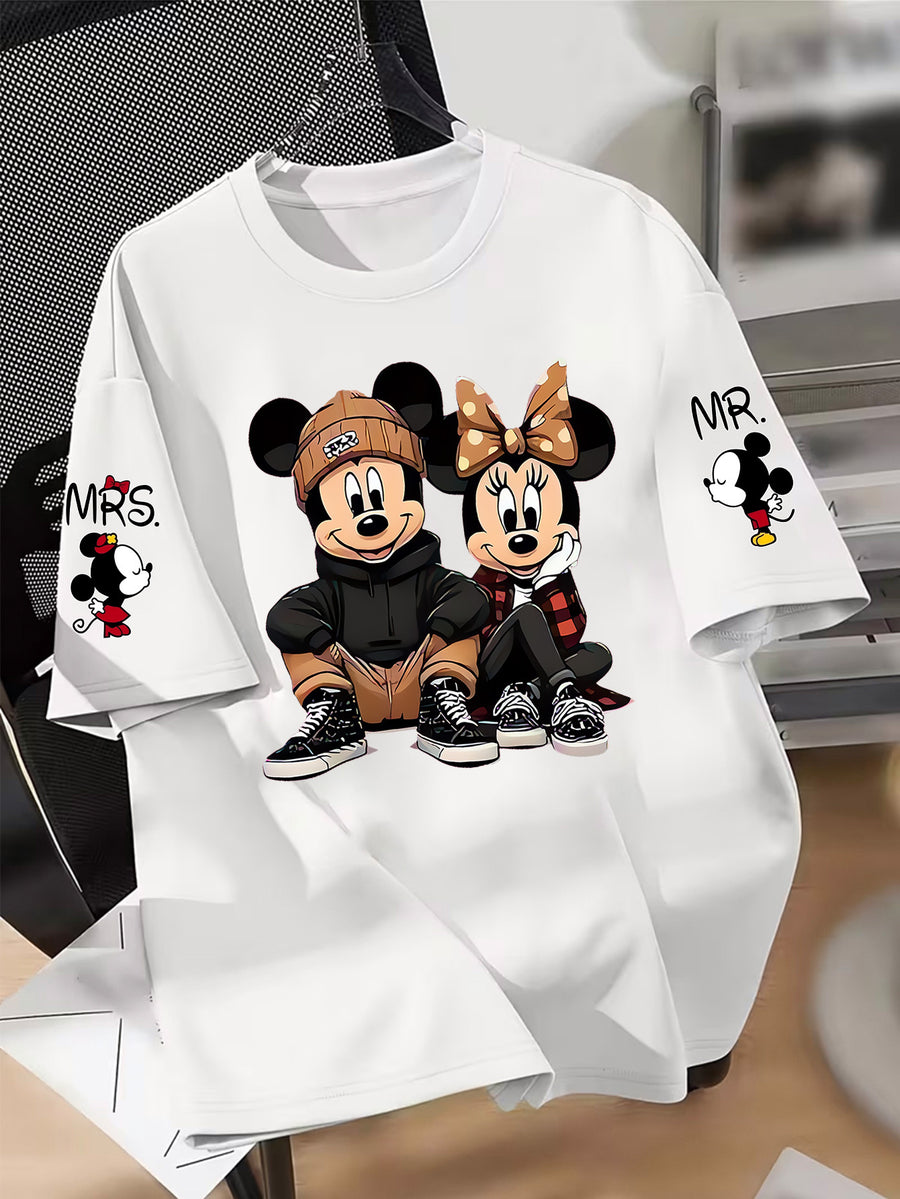 Disney Licensed Women'S Popular Printed Graphic T-Shirt Featuring Mickey And Minnie in a Trendy Street Style. This Short-Sleeve, Round-Neck Tee Has Multiple Prints on The Sleeves - White