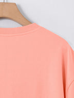 European and American Men's Short-Sleeve Crew Neck T-Shirt, Street Style, Classic Badge Pattern Print with Red Background Print, Fashionable Casual Top - pink color