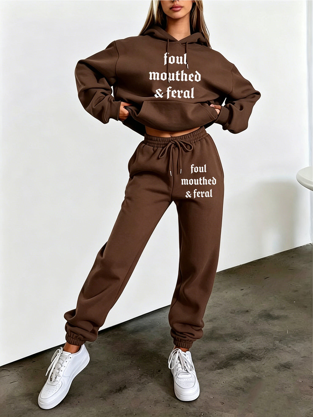 Autumn/Winter Trendy Fashion Women's Hooded Drawstring Sweatshirt and Sweatpants Set. Features a Hooded Drawstring Design and a Front Kangaroo Pocket on the Sweatshirt for Comfortable Cold-weather Wear. Classic Silhouette with a Comfortable Fit. - Coffee Color