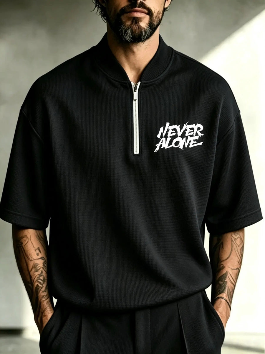 Men's Waffle Knit Half-Zip Polo Shirt with Punk Graffiti "NEVER ALONE" Print - Stand Collar Short Sleeve T-Shirt Suitable for Spring/Autumn, Loose Fit Streetwear, Machine Washable Urban Fashion Top - Black