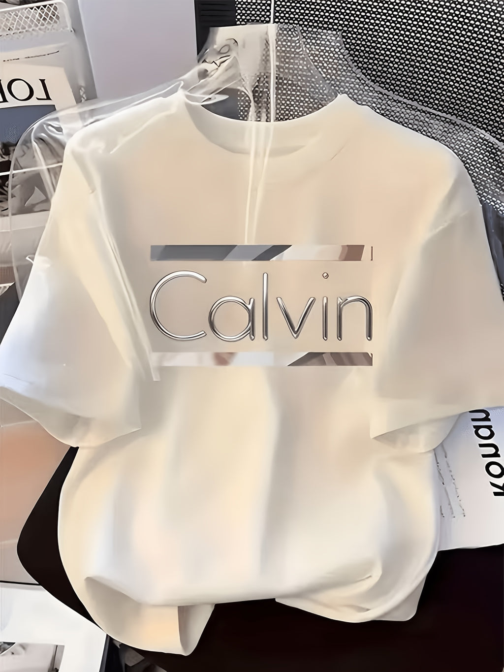 Women's Crew Neck Short Sleeve T-Shirt Decorated with Metallic Silver "Calvin" Print & Rectangular Background Design, Made of Soft Polyester Fabric, Casual Tops Available in Multiple Styles, Perfect for Daily Casual Outfits and Home Loungewear - White