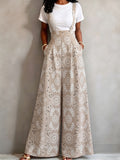 New 2026 Spring/Summer Ethnic Floral Print High-Waist Suspender Wide-Leg Pants for Women. Features a Built-in Back Zipper for a Loose, Figure-flattering Fit. Includes a Hidden Side Waist Zipper and Practical Side Pockets for Storing Small Items. - Khaki
