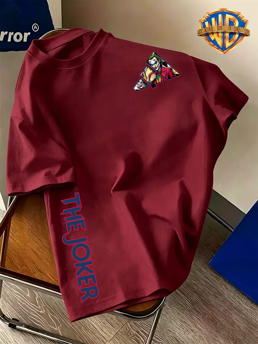 Warner Bros. Official Double-Sided Print Men's Short-Sleeve T-Shirt, Featuring a Triangular Frame Patchwork Design with a DC Comics Classic Panel-style Joker Image Creatively Paired with "THE JOKER" Lettering Print for a Complementary Look. - Burgundy