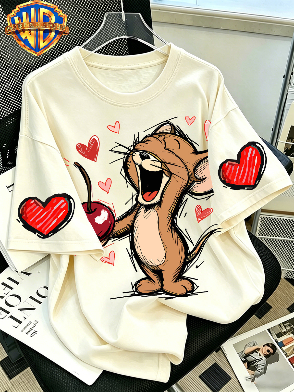 Official Warner Bros. T-shirt Featuring a Print of a Classic Character Laughing While Holding a Cherry; Men's 100%, Comfortable, Versatile, and Loose-fitting Short-sleeve Summer Tee-suitable for Outdoor Activities and Casual Attire. - Apricot