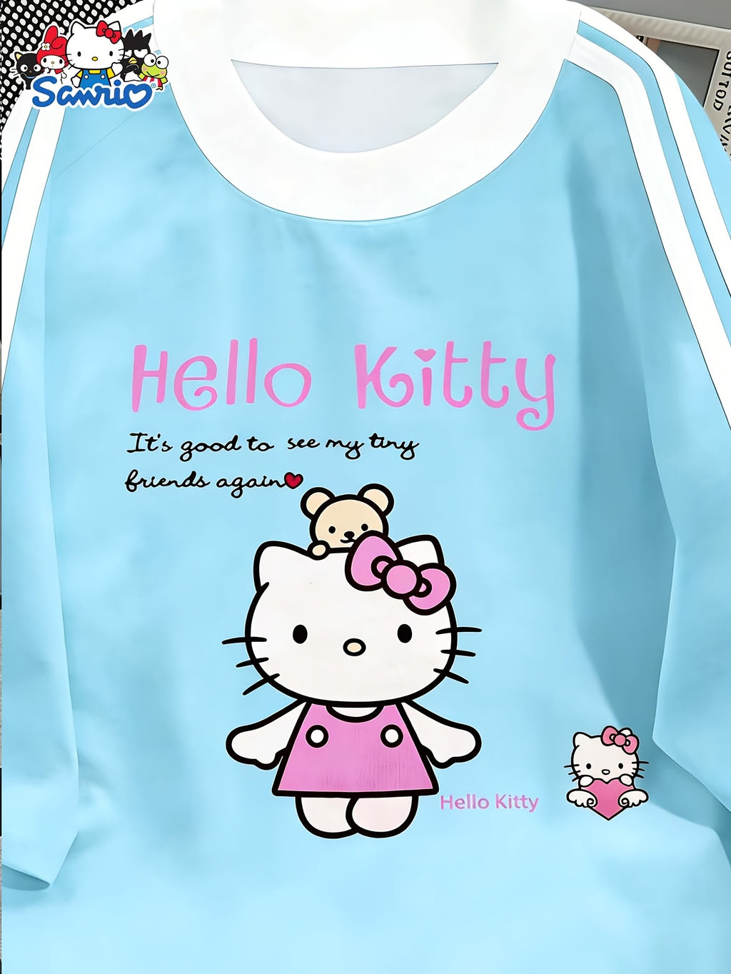 Sanrio Hello Kitty Cartoon Pattern Casual Fashion T-shirt from Sanrio, Black Contrasting Design, Round Neck Short Sleeved Shirt, Cute T-shirt, Perfect for Spring and Summer Casual Wear and Holiday Gifts - Powder blue