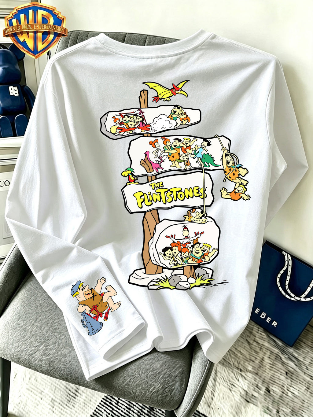 By Warner Bros., Featuring a Lively and Nostalgic Cartoon Print Design with Multiple Scenes of Road Signs, This Men's Comfortable 100% Pure Cotton Long Sleeved T-shirt Is Suitable for Outdoor Sports and Fitness - White