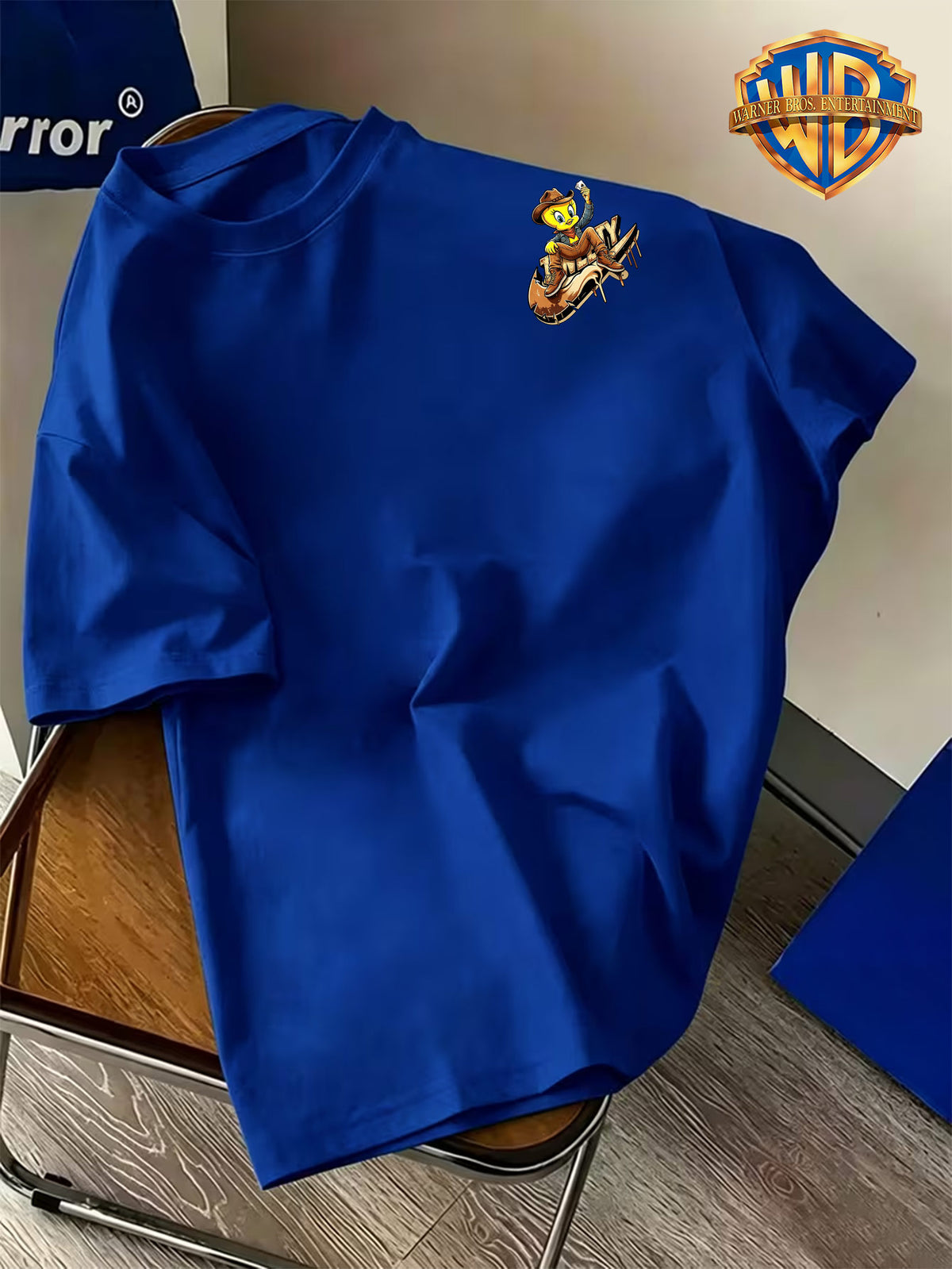 Warner Bros. Official Men's Short-Sleeve T-Shirt with Front and Back Print. Features a Creative  Core Western Cowboy Style Design with  Bird Holding Playing Cards. The Vibrant Print Creates a Strong Atmosphere, Making the Shirt Eye-catching - Royal Blue