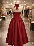 Elegant Solid Color Halter Neck Dress with Back Tie, Gathered Front, Ruched Waist, Slim Fit, and Flared Hem, Suitable for New Year's, Valentine's Day, Parties, Graduations, Weddings, Engagements, Dates, Dinner Parties, and Bridesmaid Attire - Red