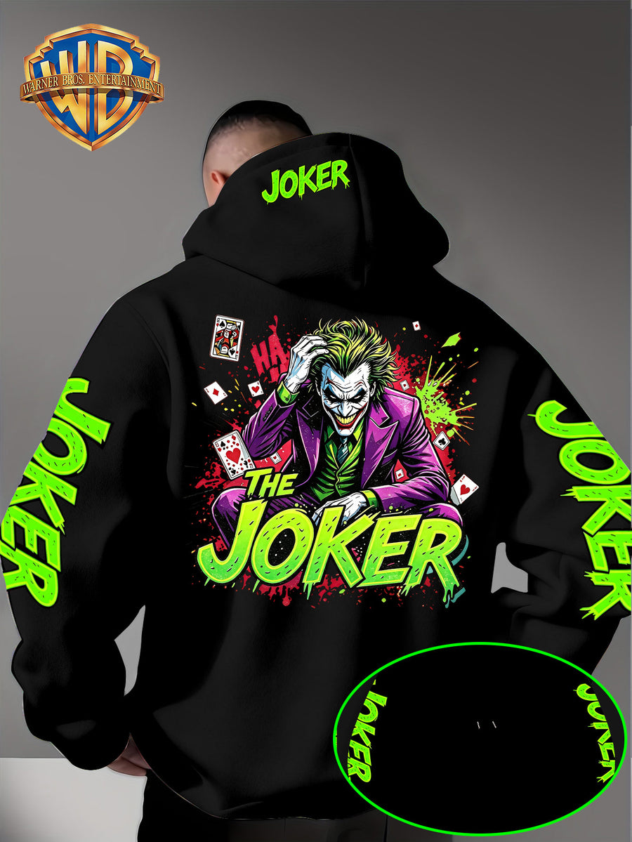 Official Warner Bros. Joker Comic-style Print Featuring Red and Green Ink-splatter Effects and "THE JOKER" Lettering. The Sleeves and Back of the Hood Are Adorned with Green "JOKER" Lettering. This Men's Trendy Printed Hooded Sweatshirt Features - Black