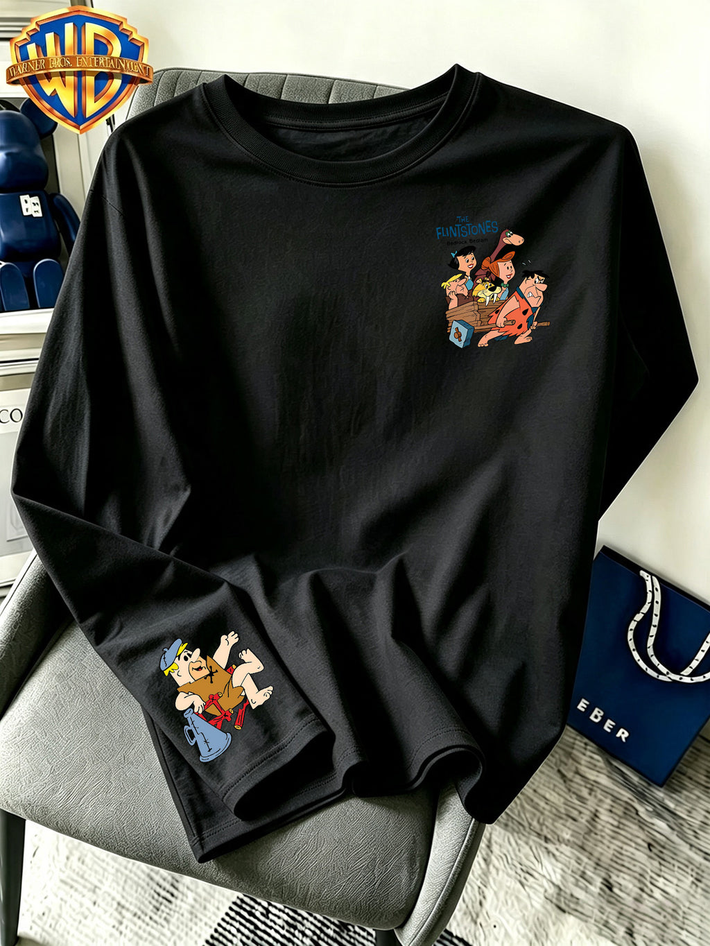 By Warner Bros., Featuring a Lively and Nostalgic Cartoon Print Design with Multiple Scenes of Road Signs, This Men's Comfortable 100% Pure Cotton Long Sleeved T-shirt Is Suitable for Outdoor Sports and Fitness - Black