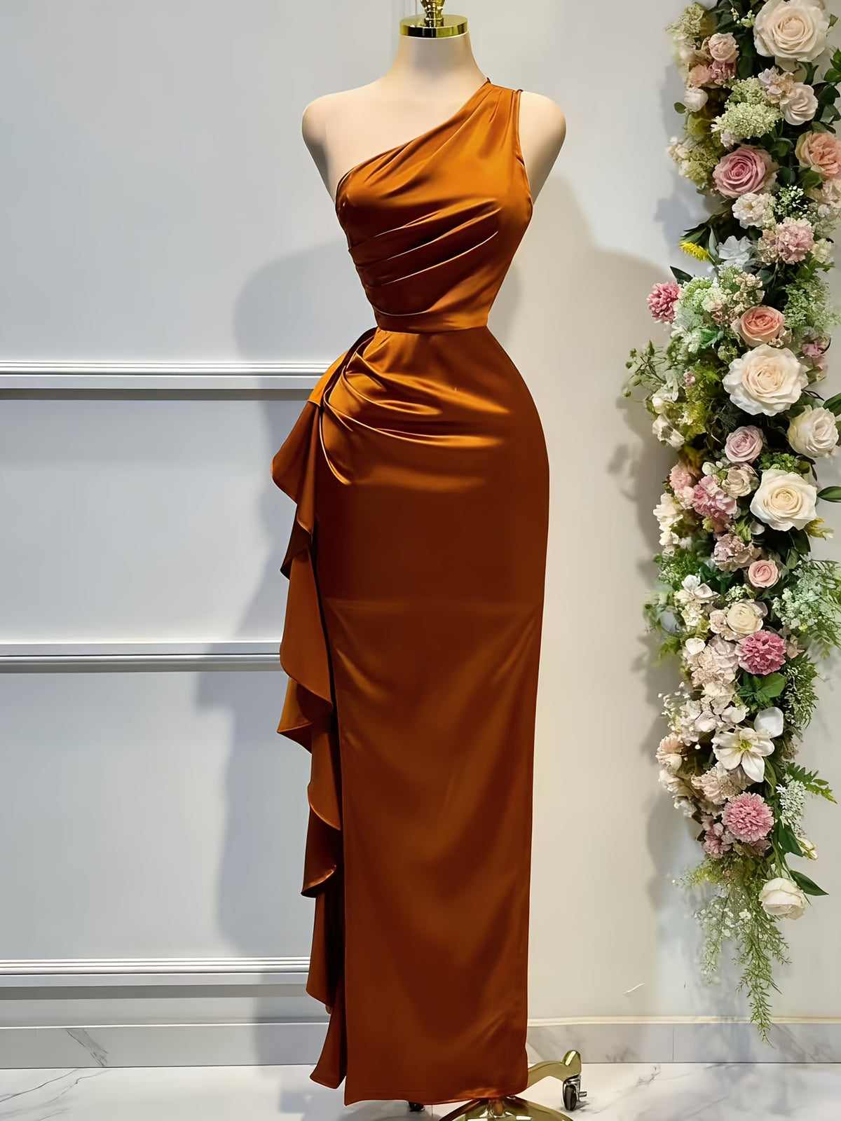An Elegant Solid Color Satin Dress with an Asymmetrical Ruffled Hem, Off-Shoulder Neckline, And a Backless Design, Perfect for Banquets, Parties, Weddings, Or As a Bridesmaid Gown - Rust