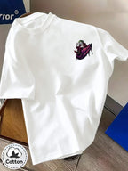 Warner Bros. Official Unisex Summer Loose-Fit Crew Neck Short-Sleeve T-Shirt, Suitable for Daily Commutes, Street Outings, City Trips, and Friend Gatherings. Features a Large Burgundy Suit-wearing Joker Sitting on Purple Graffiti Sneakers - White