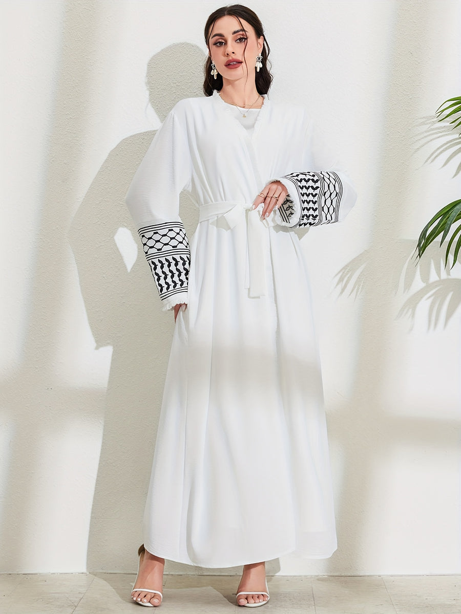 A Loose Black And White Embroidered Muslim Dress in a Single Piece - a Dubai-Style Elegant And Conservative Outerwear with Tassels And a Belt Suitable for All Seasons - White