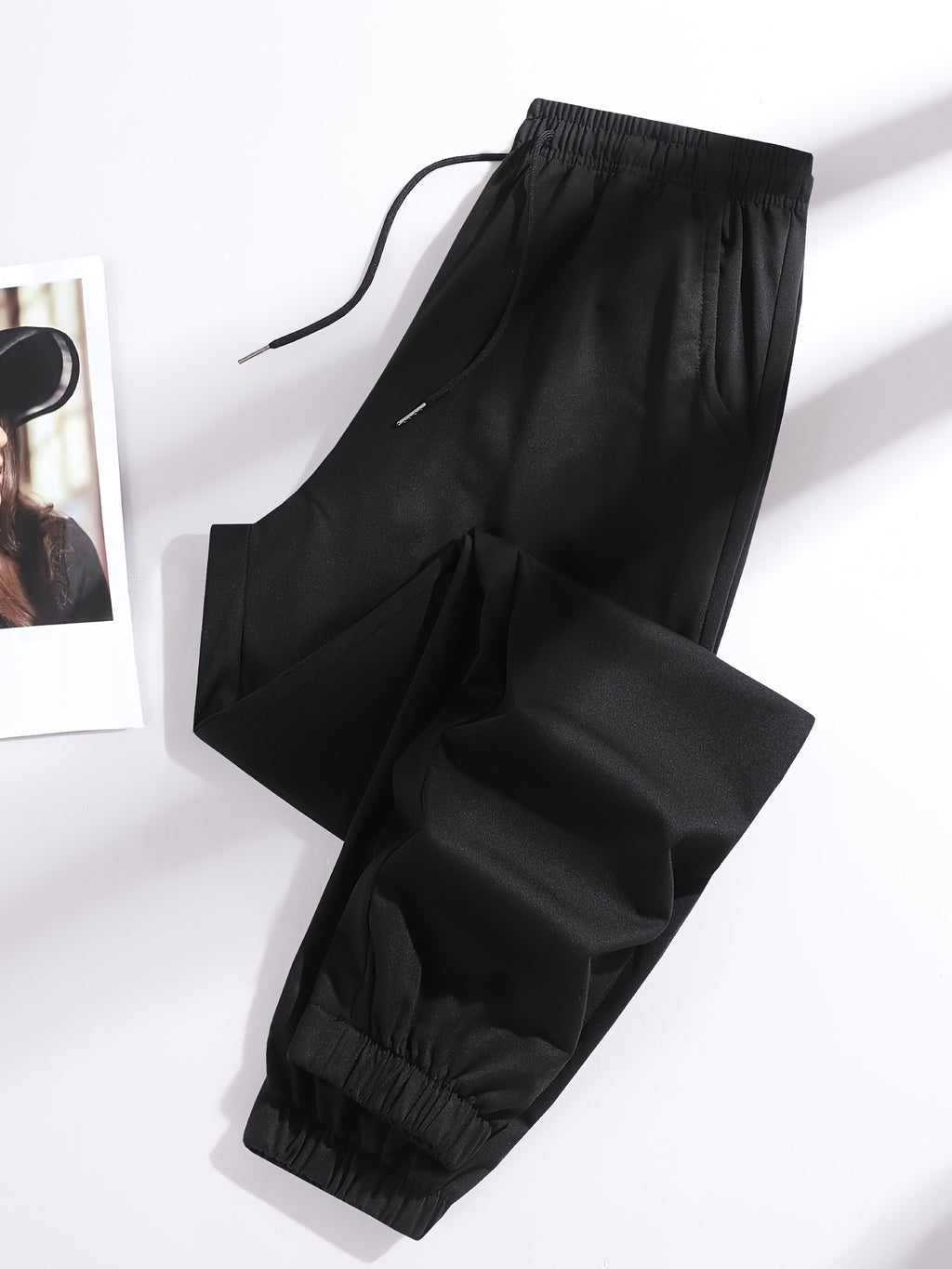 A Pair of Summer Women'S Long Pants, Casual Trousers for Women, Made of And, Featuring Elastic Fabric with Tapered Legs, an Elastic Drawstring at The Waist, Side Pockets, Suitable for Outdoor, Camping, Wear, And Women'S Pants. - Black