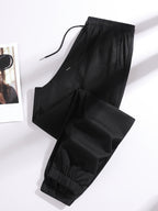 A Pair of Summer Women'S Long Pants, Casual Trousers for Women, Made of And, Featuring Elastic Fabric with Tapered Legs, an Elastic Drawstring at The Waist, Side Pockets, Suitable for Outdoor, Camping, Wear, And Women'S Pants. - Black