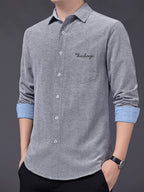 Men's Oxford Cloth Long-Sleeve Shirt for Spring/Autumn, with Lapel Collar, Simple Pocket, and English Print Decoration. Features Contrast Color Cuffs and Collar Design. A Versatile Basic Shirt for Business Casual Wear, Available in Multiple Colors - Grey