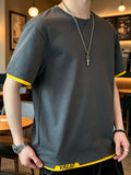 Men's Summer Color-Block 2-in-1 Look Short-Sleeve T-Shirt, Korean-Style Minimalist Casual Crew Neck Top. Features Contrast-color Binding on Both Cuffs and Hem, with Letter-printed Trim at the Hem for Added Detailing. Made from Combed Cotton Fabric - Dark Gray