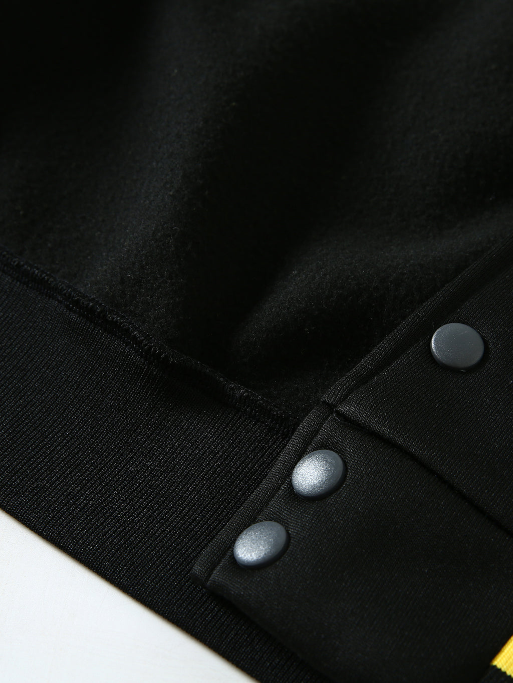 This Black And Gray Patchwork Baseball Jacket Features a Button Closure Design, with Black And White Striped Accents at The Collar And Cuffs. It Showcases Prominent Letter Prints And English Text Elements on The Chest - Black And Yellow