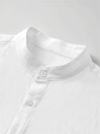 Men's Solid Color Casual Stand Collar Button- Long Sleeve Shirt. The Solid-colored Fabric Offers a Comfortable Feel, Making It a Great Gift for a Husband or Boyfriend for Home, Outings, Travel, and Beach Vacations. Men's Long Sleeves, Men's Tops - White