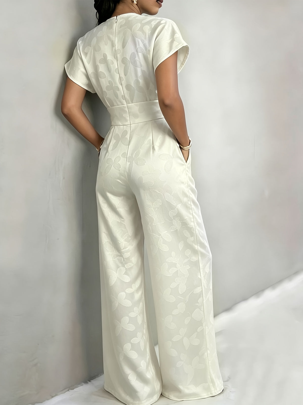 New Spring/Summer 2026 Women's Jacquard Short-Sleeve Jumpsuit with Subtle Butterfly Pattern, V-Neck, Cinched Waist, and Wide-Leg Pants. This Light Luxury, High-end Jumpsuit Offers a Sophisticated Look for Commuting. The Simple and Exquisite V-neck - Off-white