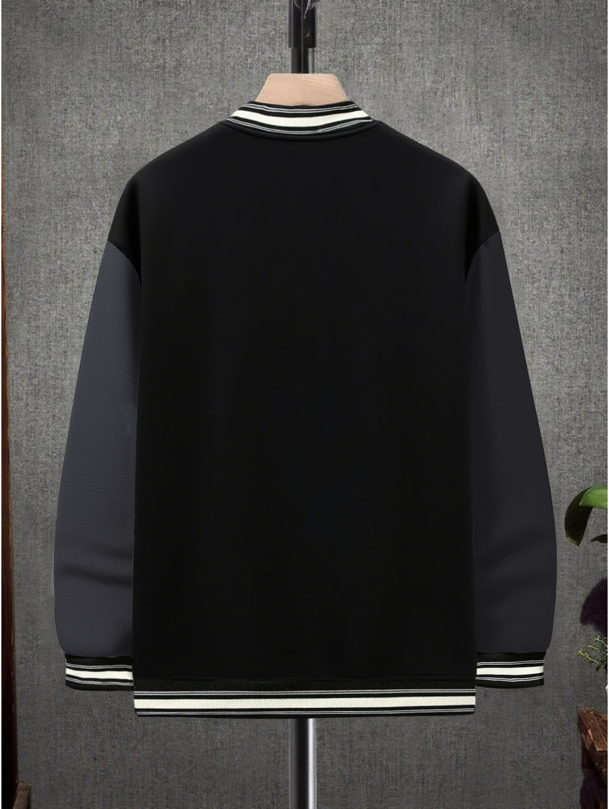 This Black And Gray Patchwork Baseball Jacket Features a Button Closure Design, with Black And White Striped Accents at The Collar And Cuffs. It Showcases Prominent Letter Prints And English Text Elements on The Chest - Black And Grey