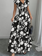Elegant Pink Floral Maxi Dress with V-Neck and Short Sleeves - Flowing A-Line Silhouette, Cinched Waist, Perfect for Spring/Fall, Casual to Formal Wear, Casual Elegant Wear | Floral Print Dress | Cinched Waist Design - White Flower On Black Background