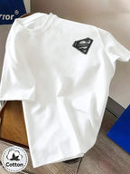 Unisex Summer Loose Round Neck Short Sleeve T-Shirt, Suitable for Daily Commute, Street Outings, City Travel, And Gatherings, Large Superman S Logo Hand-Drawn Sketch Print on Back, Small Pattern on Chest, Easy Artistic Atmosphere - White