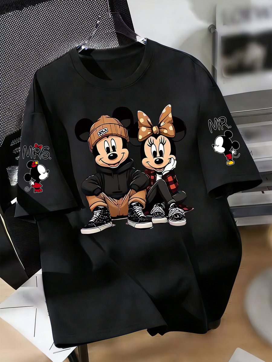 Disney Licensed Women'S Popular Printed Graphic T-Shirt Featuring Mickey And Minnie in a Trendy Street Style. This Short-Sleeve, Round-Neck Tee Has Multiple Prints on The Sleeves - Black