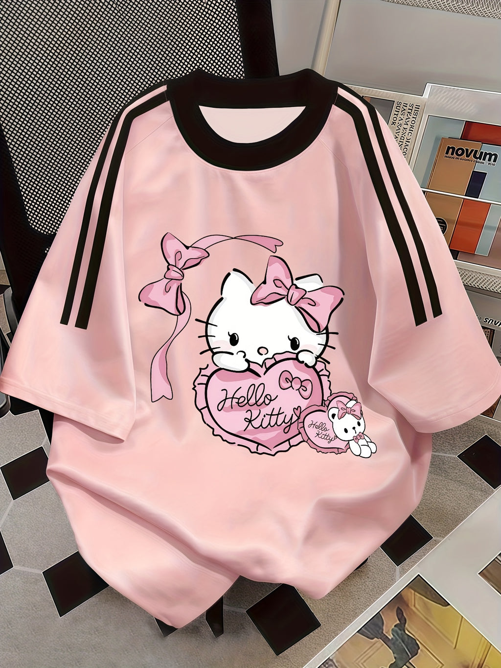 Sanrio Hello Kitty Women's Vintage T-Shirt - Pink Hello Kitty Face & Iconic Logo Print, Contrast Stripe Round Neck Short Sleeve Blouse, Loose Fit Summer Casual Top for Hello Kitty Fans - Pink
