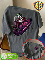 Warner Bros. Official Unisex Summer Loose-Fit Crew Neck Short-Sleeve T-Shirt, Suitable for Daily Commutes, Street Outings, City Trips, and Friend Gatherings. Features a Large Burgundy Suit-wearing Joker Sitting on Purple Graffiti Sneakers - Dark Gray