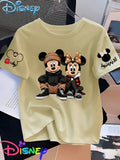 Mickey And Minnie Are Sitting Side by Side, with Mickey Hugging His Knees And Minnie Resting Her Chin on One Hand, Showcasing a Trendy Street Style Printed Short-Sleeve Women'S T-Shirt - Apricot