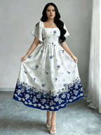 The Summer Floral-Themed Elegant Resort-Style Dress Features a Butterfly Wing Print Design, a Square Neckline And Short Sleeves, Is Equipped with a Waist-Cinching Design, And Has a Moderate Length - White