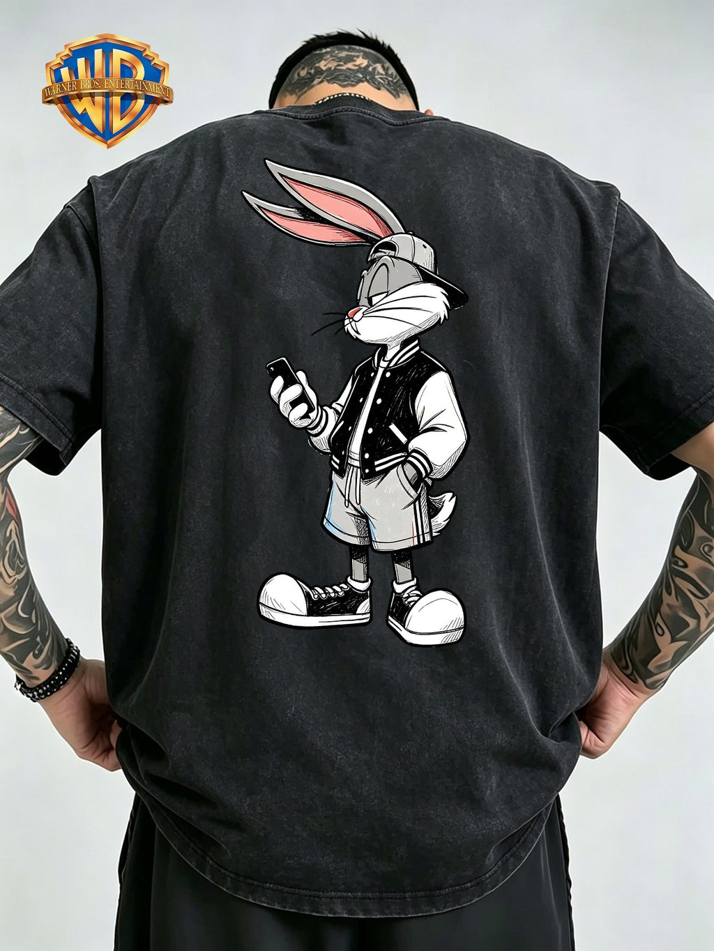 Men'S Washed Short-Sleeve T-Shirt, Back Print of Classic Cartoon Rabbit, Wearing Baseball Jacket And Hat, Holding Phone, Showcasing Trendy Street Style. Chest Adorned with Same Small Pattern, Rich in Details, Full of Design Sense - Black