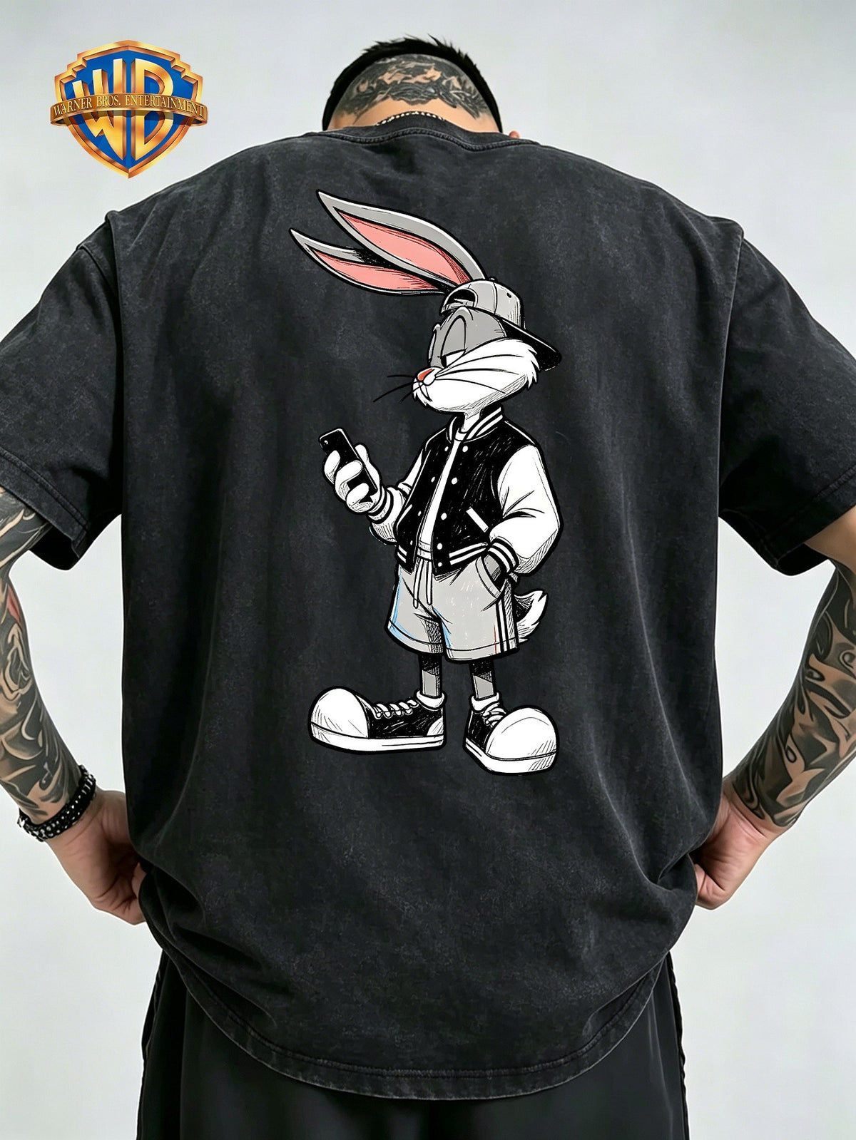 Men'S Washed Short-Sleeve T-Shirt, Back Print of Classic Cartoon Rabbit, Wearing Baseball Jacket And Hat, Holding Phone, Showcasing Trendy Street Style. Chest Adorned with Same Small Pattern, Rich in Details, Full of Design Sense - Black