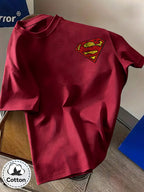 Unisex Summer Loose Round Neck Short Sleeve T-Shirt, Suitable for Daily Commute, Street Outings, City Travel, Friend Gatherings, And Casual Wear, Large Area Distressed Cracked Superman Classic S Logo Artistic Print on Back - Burgundy