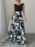 An Elegant V-Neck Floral Print A-Line Maxi Dress with Pockets - Featuring a Leaf Pattern, Short Sleeves, a Cinched Waist, And a Flowing Skirt, Perfect for Summer, Suitable for Both Casual And Formal Wear - Black