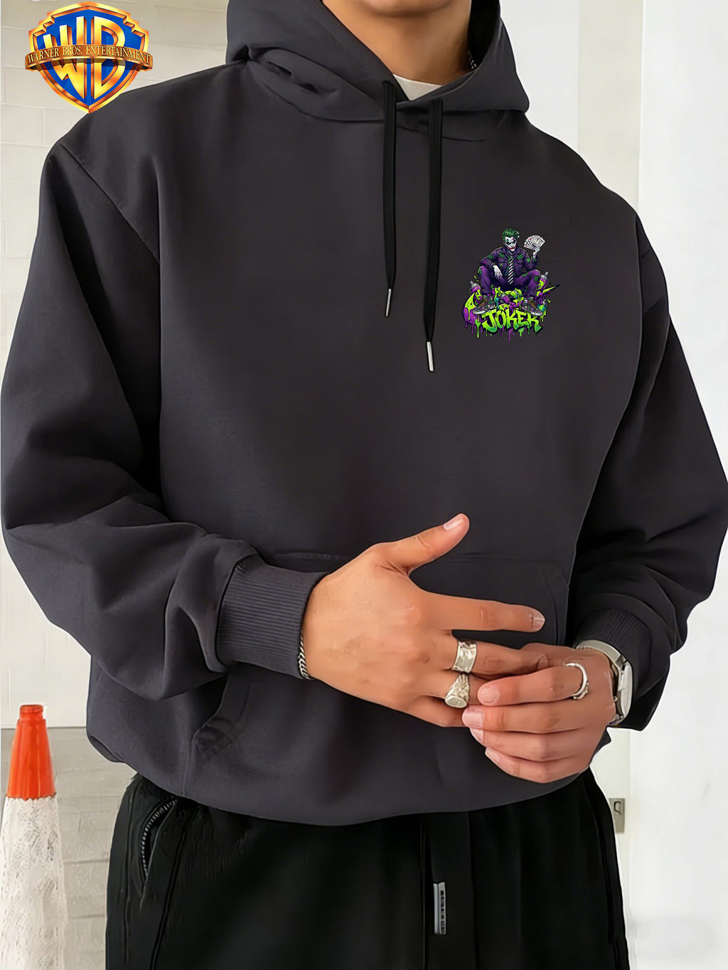 Warner Bros. JOKER Purple-Green Color Block Graffiti Art Font Spray-Painted Background Plaid Workwear Style Sneakers with Paint Drip Cool Print Men's Fashion Hooded Sweatshirt, Sleeve Print Design, Kangaroo Pocket, Drawstring Hood, Suitable for Daily - Dark Gray