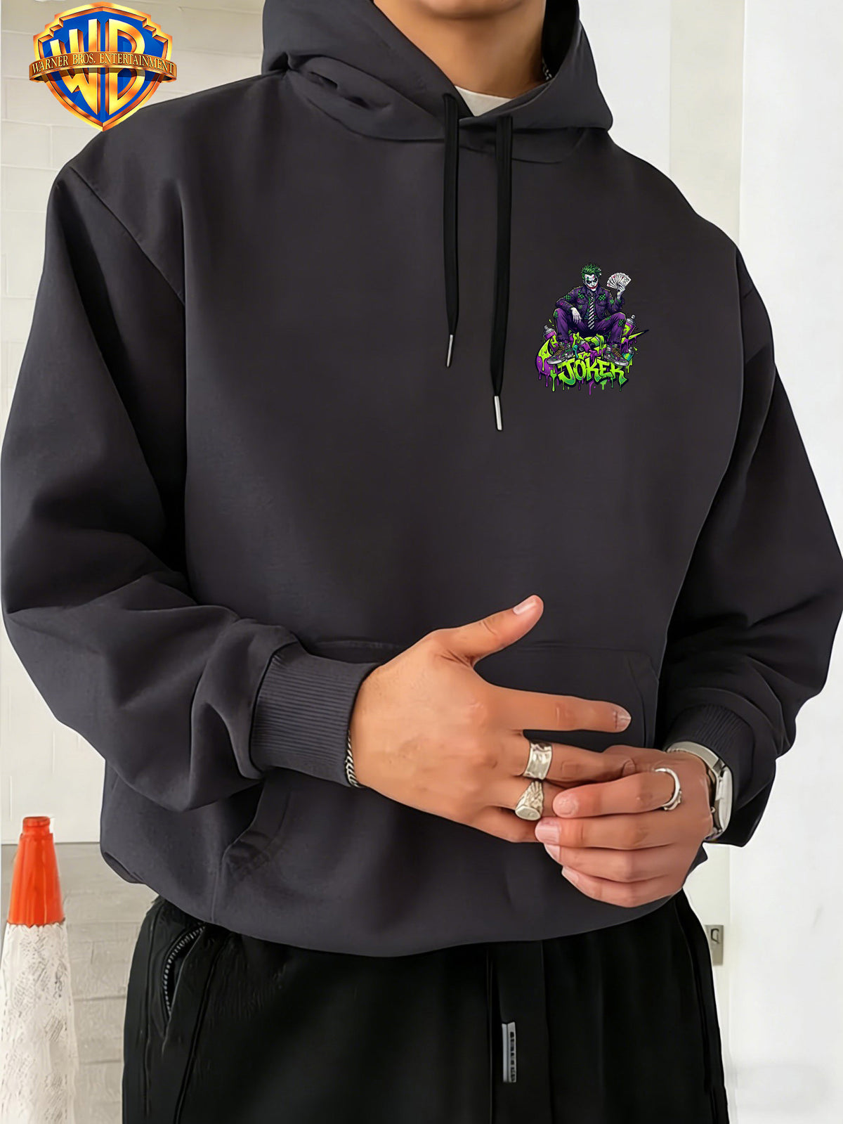 Warner Bros. JOKER Purple-Green Color Block Graffiti Art Font Spray-Painted Background Plaid Workwear Style Sneakers with Paint Drip Cool Print Men's Fashion Hooded Sweatshirt, Sleeve Print Design, Kangaroo Pocket, Drawstring Hood, Suitable for Daily - Dark Gray