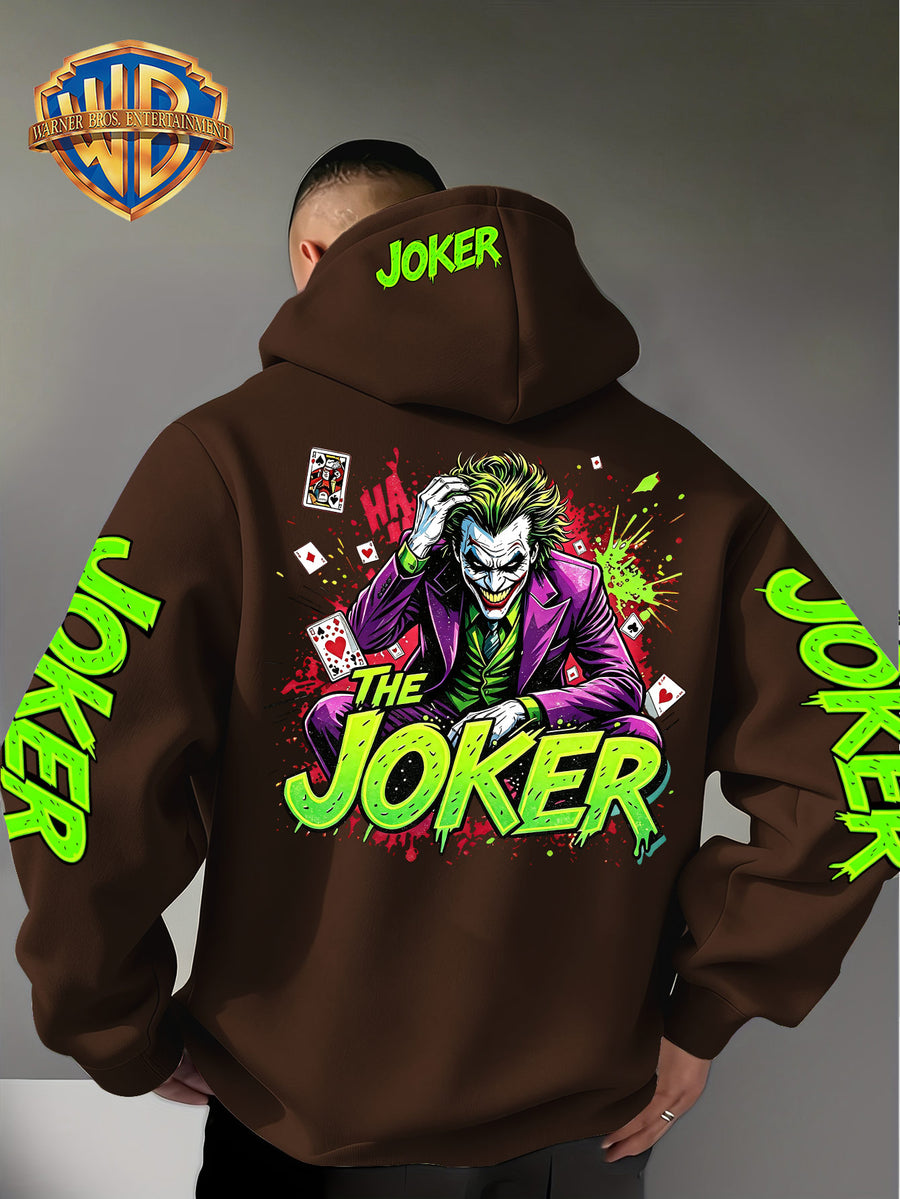 Official Warner Bros. Joker Comic-style Print Featuring Red and Green Ink-splatter Effects and "THE JOKER" Lettering. The Sleeves and Back of the Hood Are Adorned with Green "JOKER" Lettering. This Men's Trendy Printed Hooded Sweatshirt Features - Coffee Color