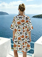 White V-neck Dress with Fun Halloween Patterns Featuring Pumpkins, Witch Hats, Black Cats, and Candy. The Refreshing Base Color Is Vibrant and Eye-catching, with Loose, Dropped-shoulder Short Sleeves for Comfort and Breathability - Mixed colors