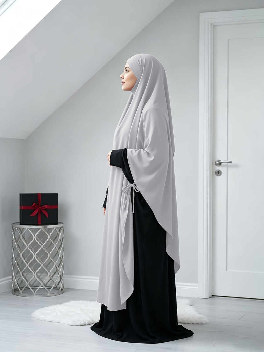 A Solid Color Nidaga Prayer Jilbab. The Fabric Is Skin-friendly and Breathable, Making It Suitable for Women to Wear and Pray Daily. The Robe Abaya Features a 1pc Design with a Khimar, Offering a Strong Drape and a Loose Fit, Ideal for Busy Daily - Light Grey