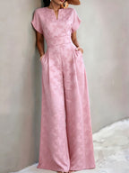 New Spring/Summer 2026 Women's Jacquard Short-Sleeve Jumpsuit with Subtle Butterfly Pattern, V-Neck, Cinched Waist, and Wide-Leg Pants. This Light Luxury, High-end Jumpsuit Offers a Sophisticated Look for Commuting. The Simple and Exquisite V-neck - Pink Color