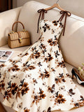 Women's Apricot-colored A-line Dress with Brown Floral Pattern, Thin Straps, and Waist Design. Perfect for Vacations, Commuting, Music Festivals, Dates, French Bohemian Style, Beach Outings, Streetwear, Versatile Wear, and Spring/summer Seasons - Mixed colors