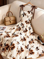 Women's Apricot-colored A-line Dress with Brown Floral Pattern, Thin Straps, and Waist Design. Perfect for Vacations, Commuting, Music Festivals, Dates, French Bohemian Style, Beach Outings, Streetwear, Versatile Wear, and Spring/summer Seasons - Mixed colors