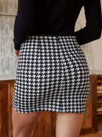 An Elegant And Stylish Short Skirt with Pleated Houndstooth Pattern, Featuring a Fitted Design Perfect for Autumn And Winter Outfits, Versatile for Everyday Wear - Black And White